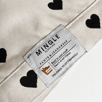 CHAQUETA MARFIL CORAZONES NEGROS